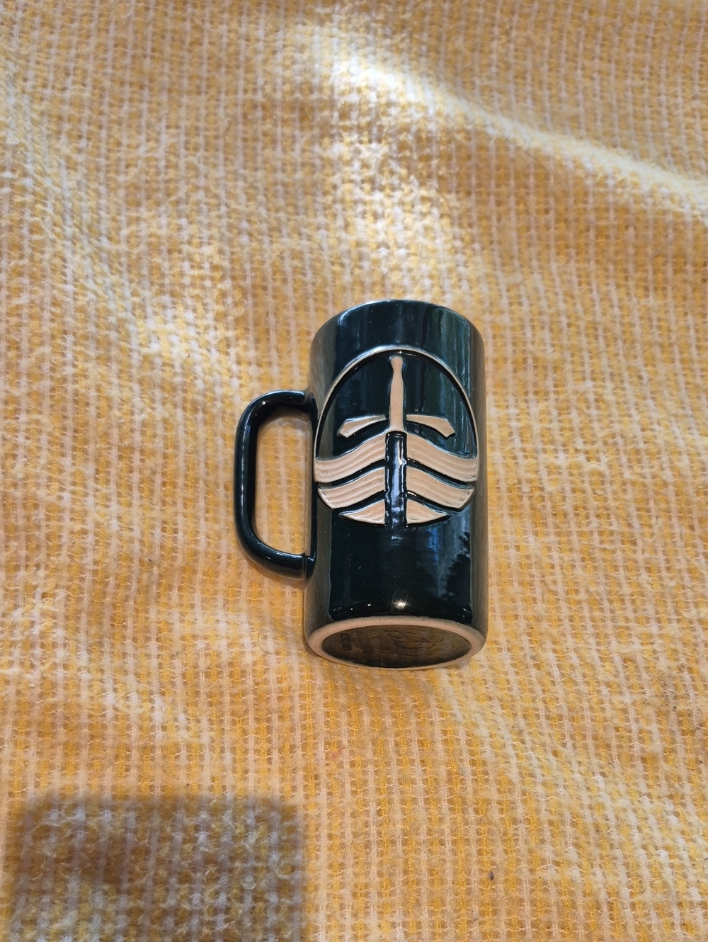 Artisan Green Pottery Ceramic Mug with Raised Sword Emblem